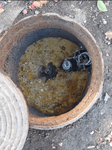 Image of a build-up of fats inside a manhole in Otara