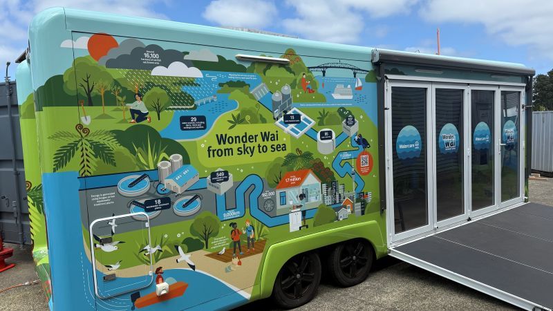 Photo of colourful mobile visitors centre Wonder Wai with the sky to sea water journey on the outside