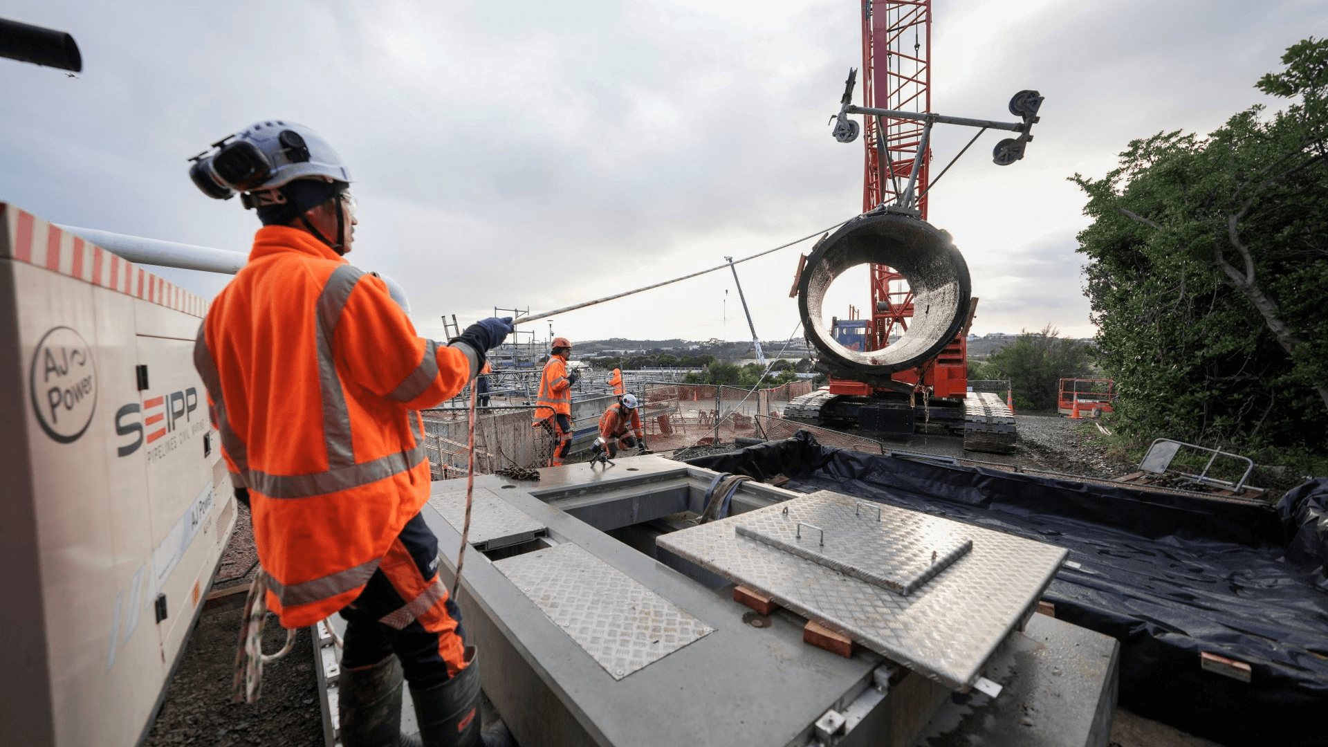A section of the Wairau Valley wastewater pipeline being lifted out by crane..jpg