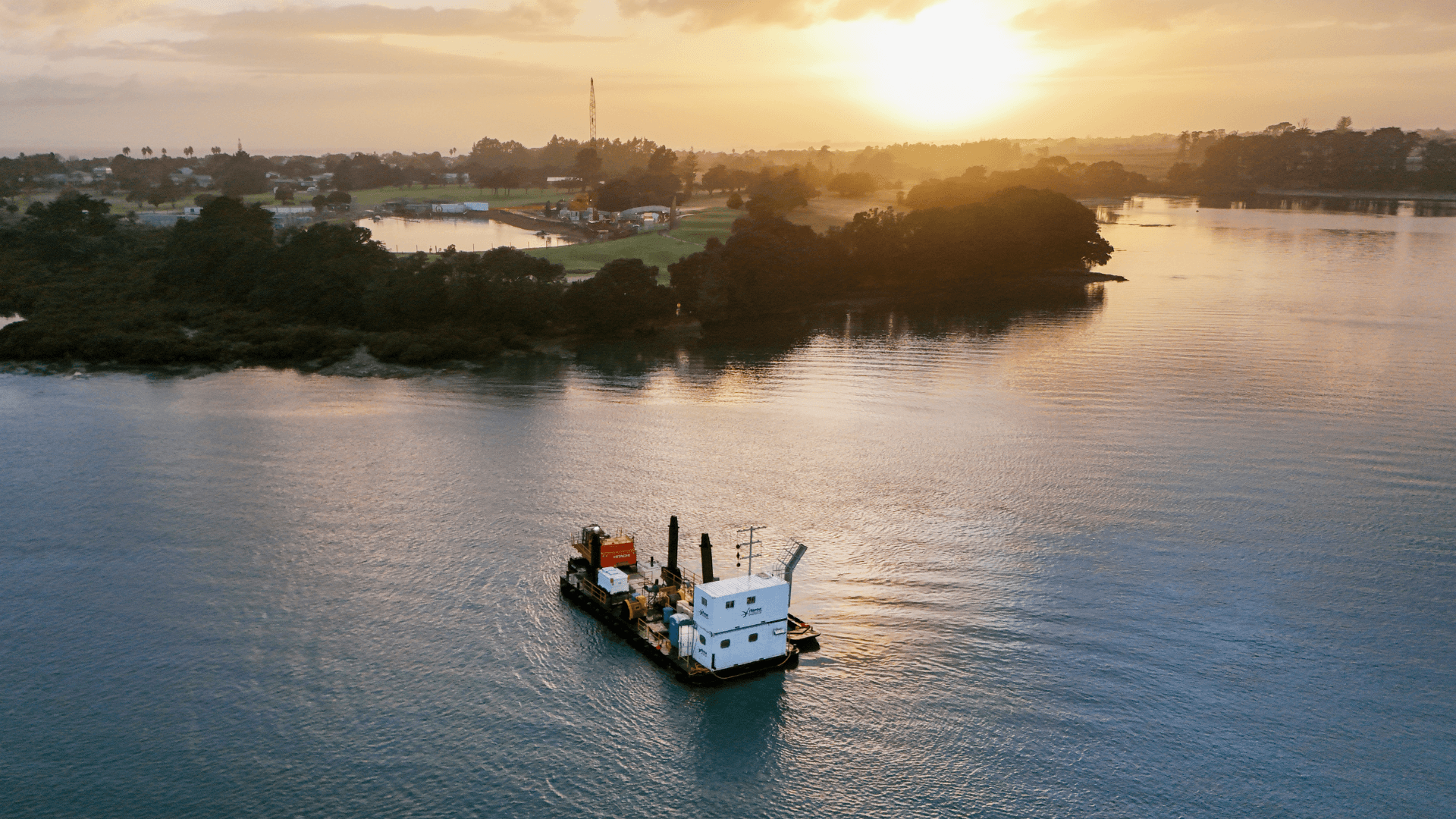 aerial_shot_clarks_beach_wastewater_treatment_plant_upgrade_and_barge